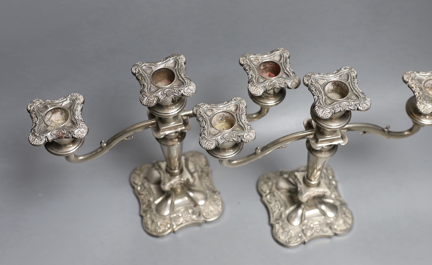 A pair of two branch, three light plated candelabra - 26cm high